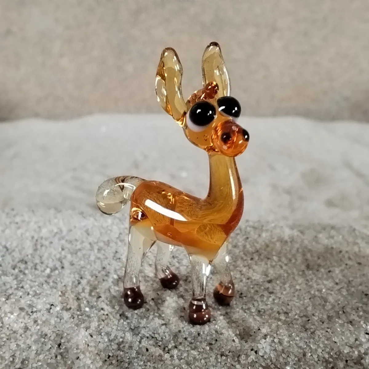 Skleněná figurka lamy