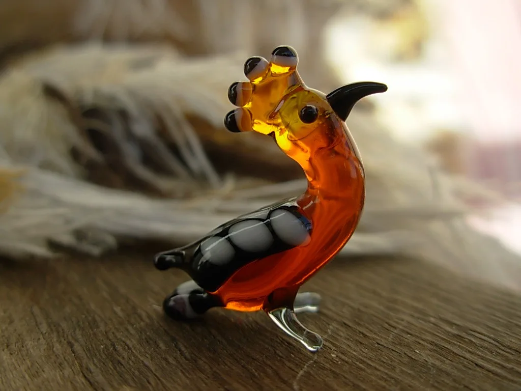 Skleněná figurka dudka