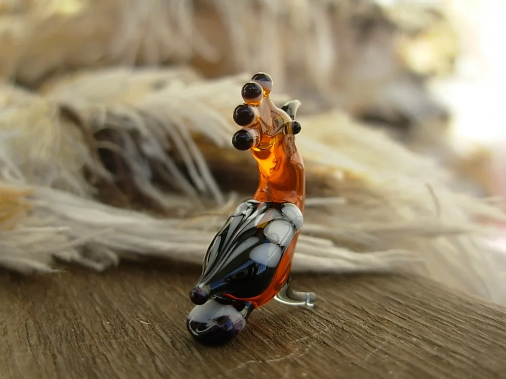 Skleněná figurka dudka